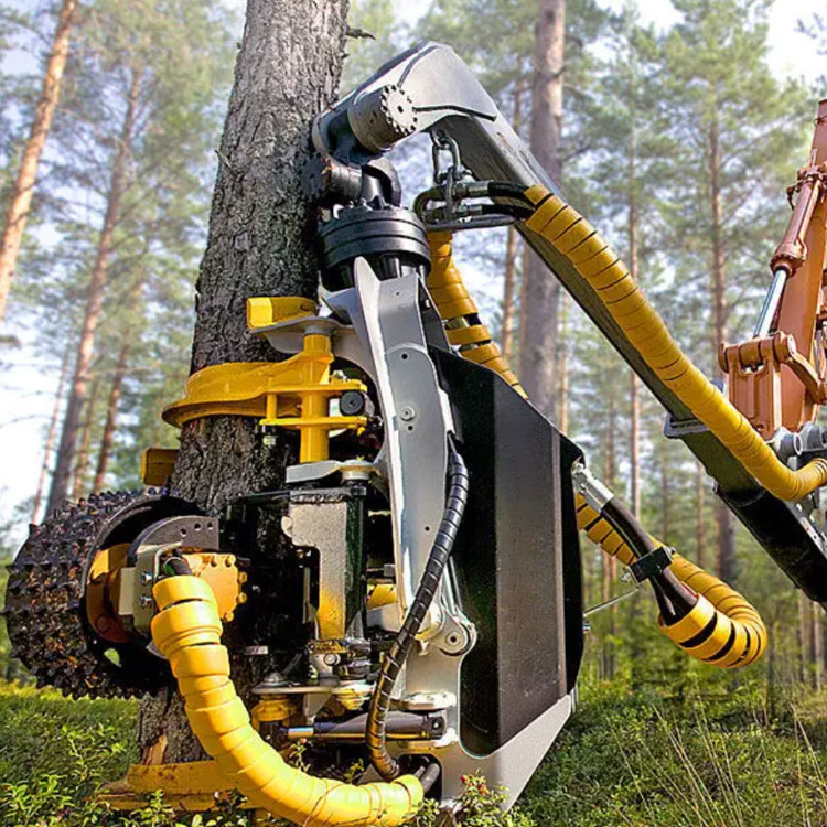 Tree harvesting processor head on standing treeStanding tree processor head in forestry operation