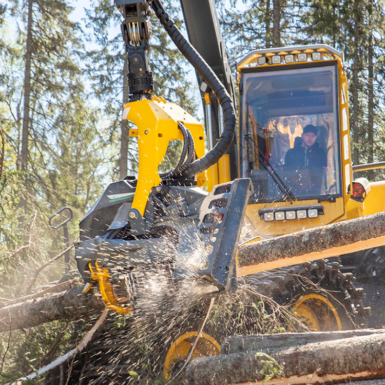 Logging harvester head cutting timberHarvester processor head in active forestry work