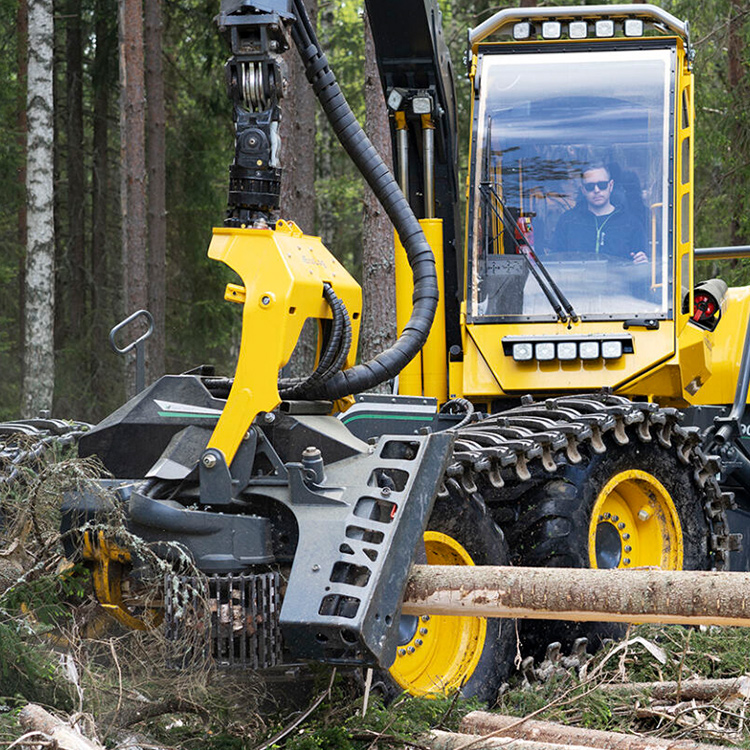 Processor head feeding long log in forestForestry processing head handling timber stem