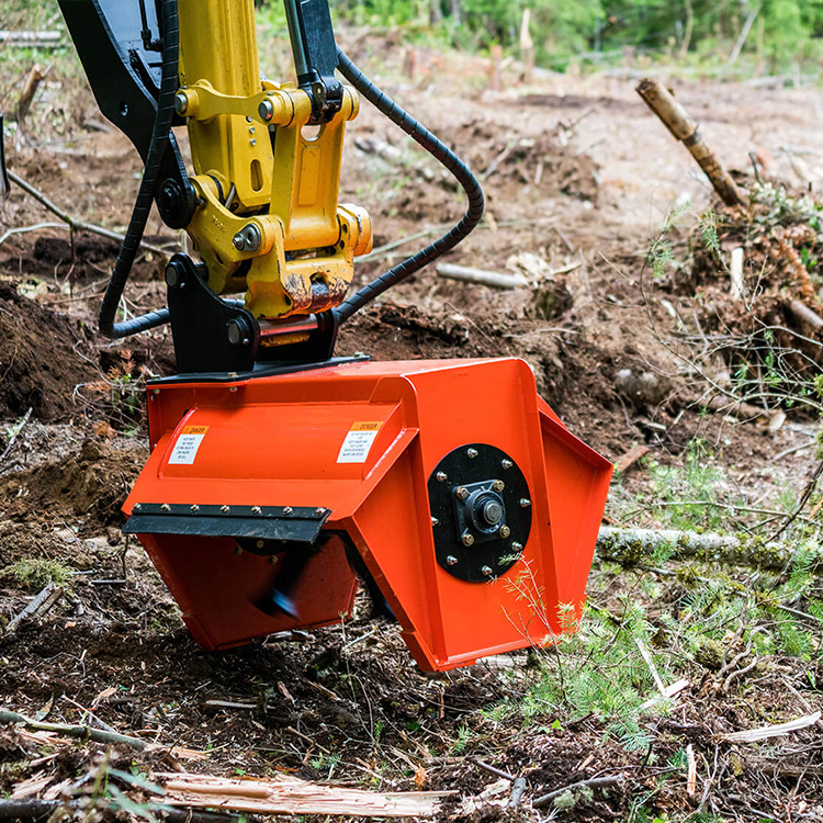 Excavator flail mulcher working close to ground in forest clearing area