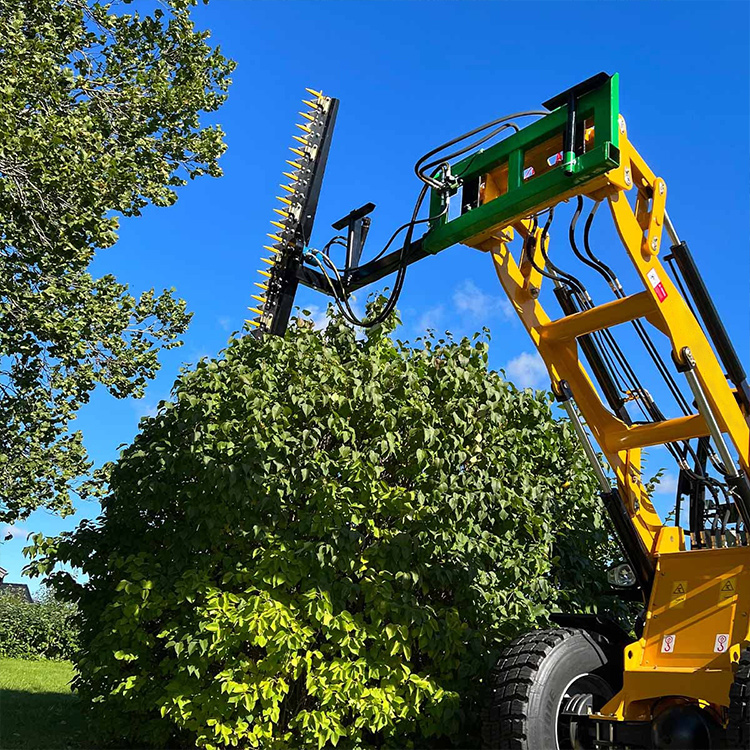 Hedge trimmer attachment cutting the top of a large hedge