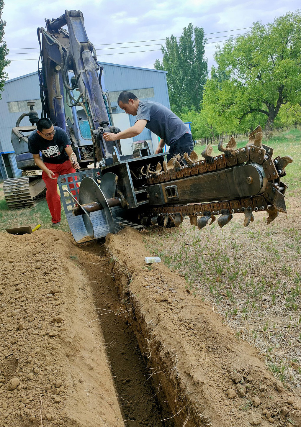 excavator chain trencher attachment installation scene